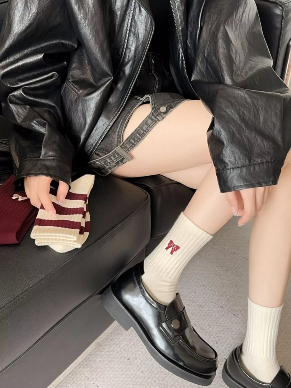 Cream bow socks worn with loafers