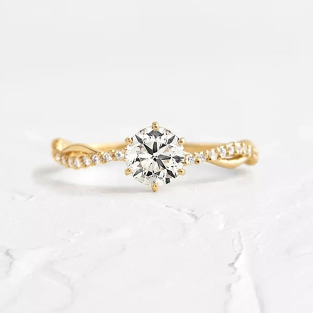 Profile view of the raised round zircon center on the sterling silver ring