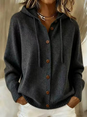 Detail of tan knit cardigan ribbed hem and pockets