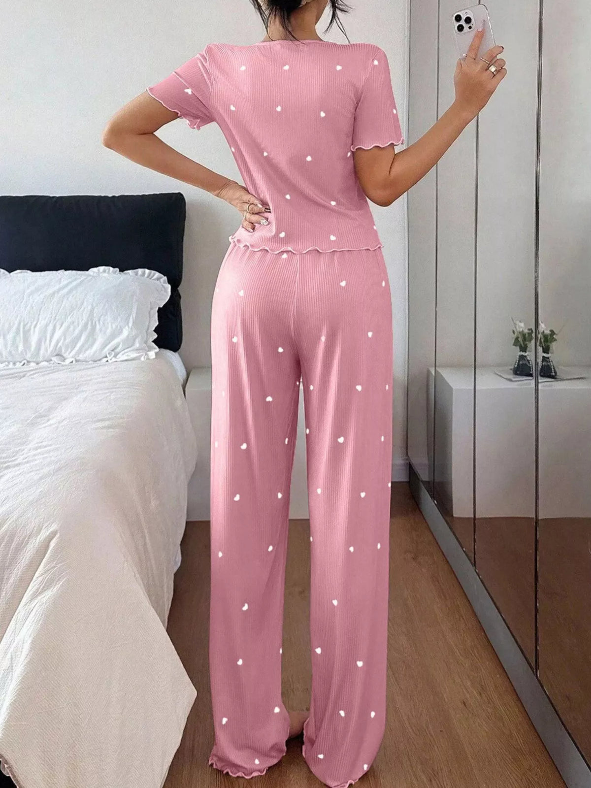 Back view of pink heart-print top and matching pants
