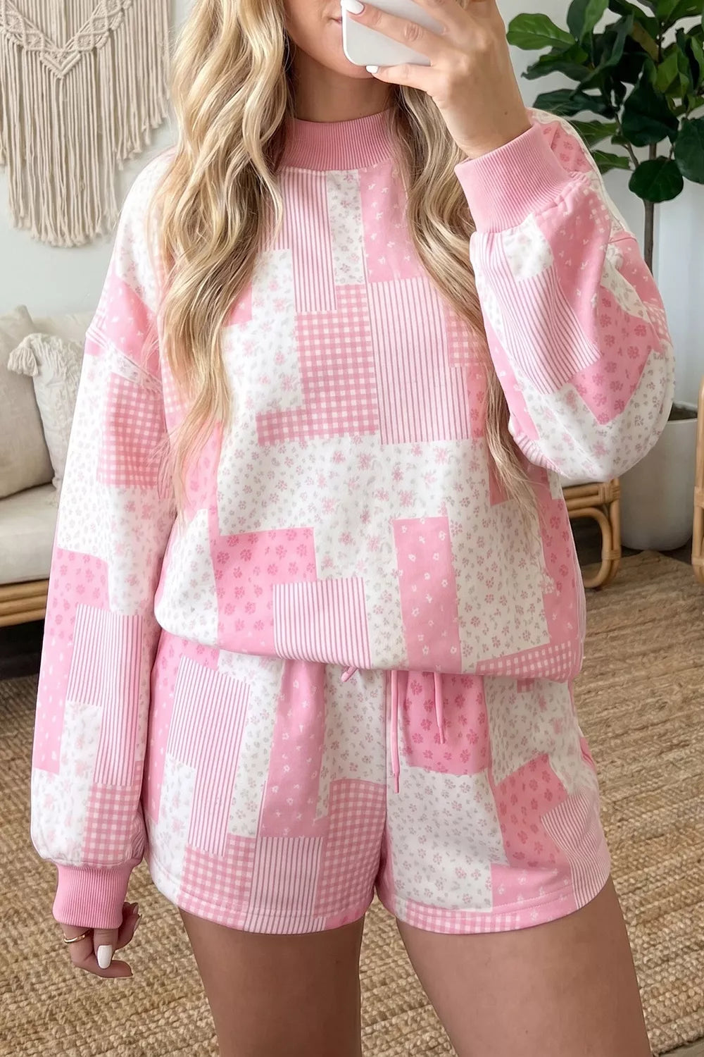 Blush pink patchwork floral pullover and drawstring shorts set shown from the front