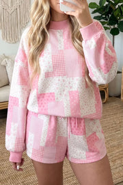 Blush pink patchwork floral pullover and drawstring shorts set shown from the front