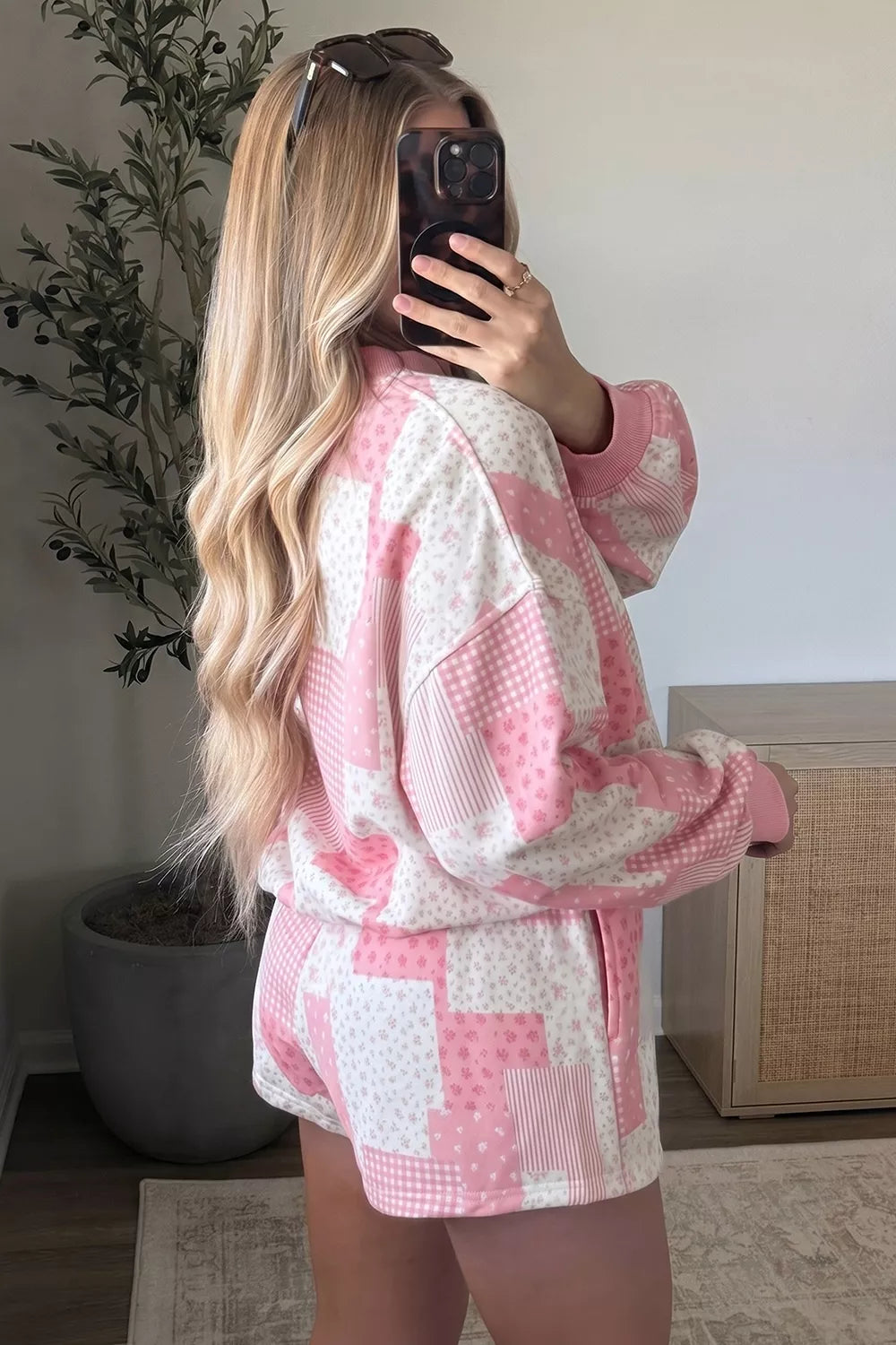 Side view of blush pink patchwork pullover and matching shorts