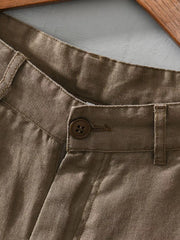 Close-up of khaki shorts waistband and pocket