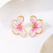 Pair of pink-and-white flower stud earrings, front view