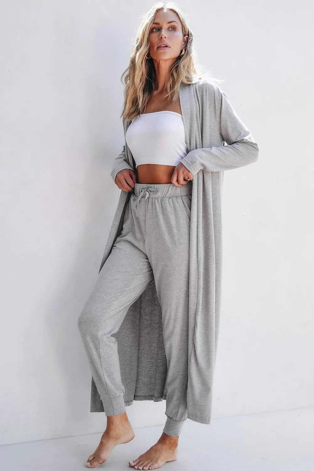 Front view of model wearing gray open-front cardigan with matching lounge pants