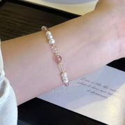 Close-up of the pearl and crystal bracelet on a wrist