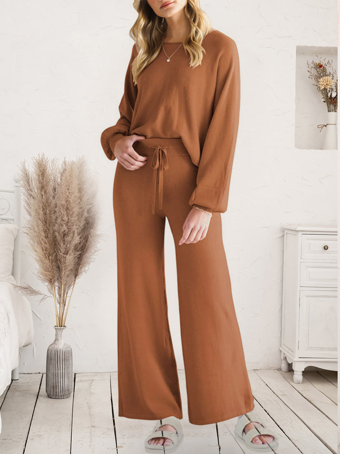 Model wearing brown V-neck lounge top and matching wide-leg pants