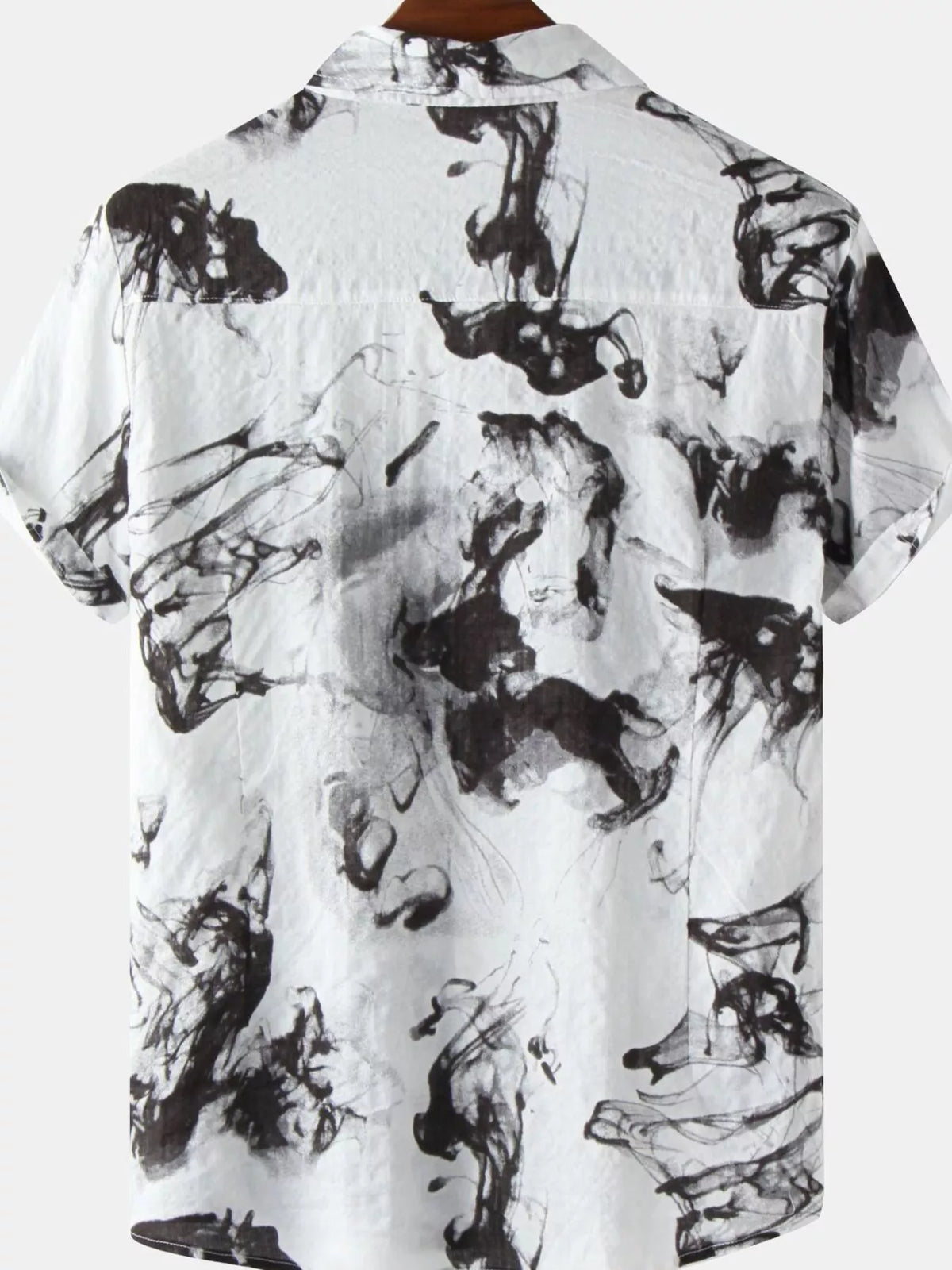 Back of a white short-sleeve shirt with black ink-splash print