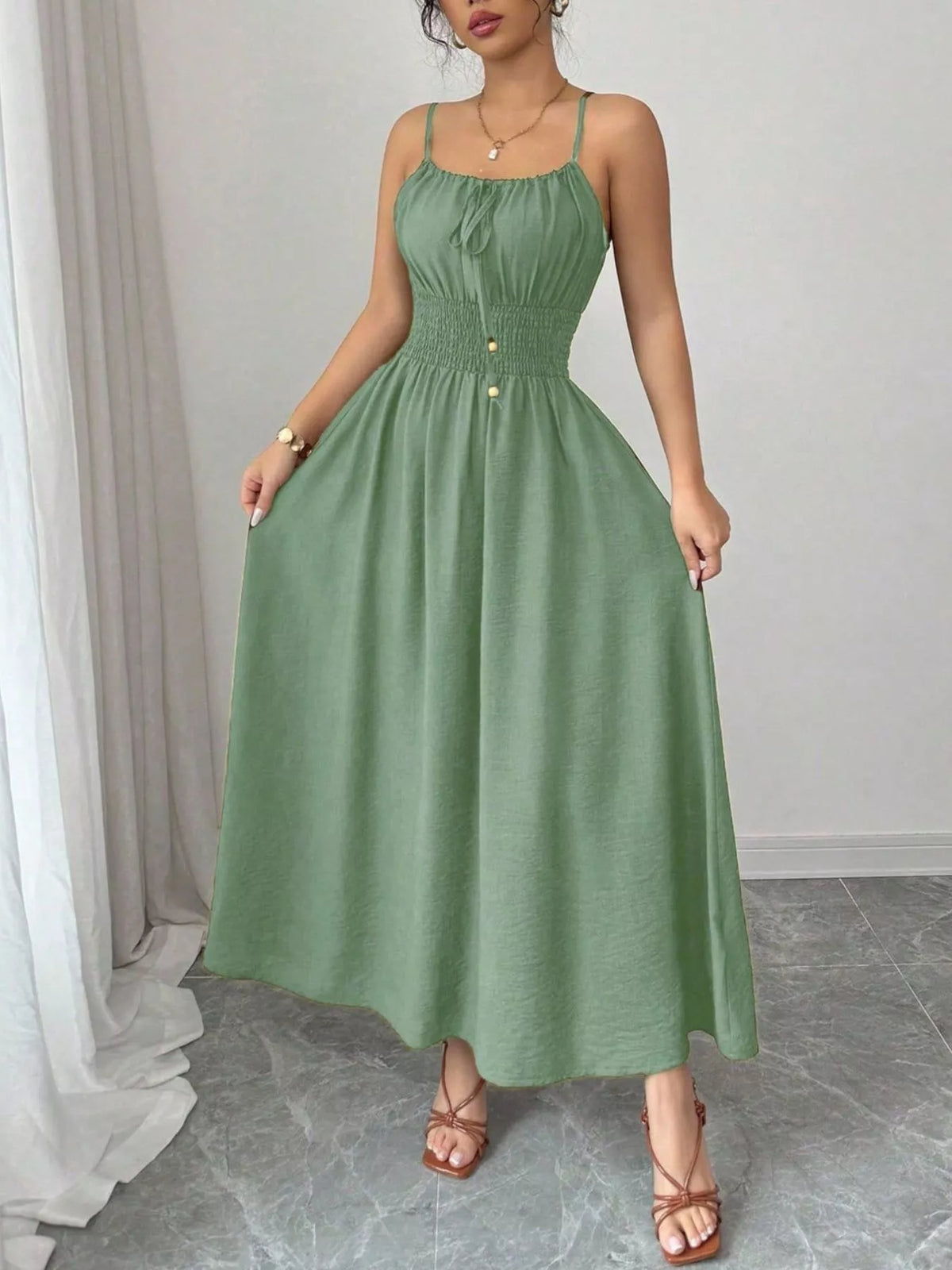 Matcha green smocked midi dress, front view with gathered waist