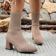 Front view of a pair of taupe ribbed knit sock boots with block heels