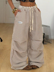 Front view of brown-and-cream striped wide-leg pants with drawstring waist