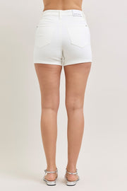 Back view of white high-waisted shorts on a model.