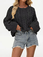 Women’s cable-knit half-button openwork sweater in black front view