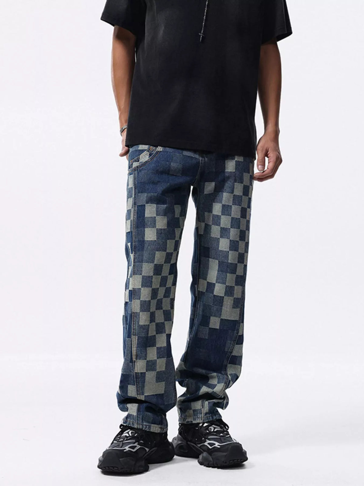 Front view of blue checkerboard jeans styled with a black T-shirt