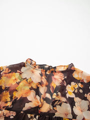 Women's floral V-neck puff-sleeve blouse, close-up of floral neckline