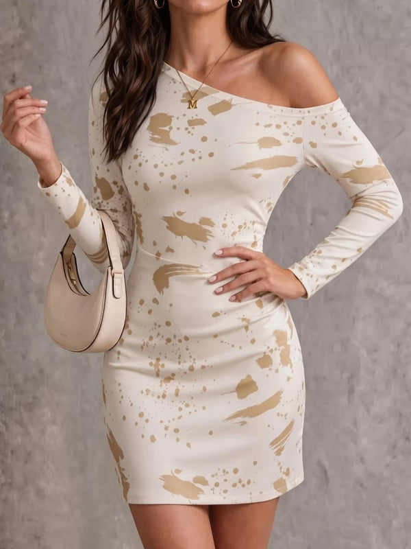 Front view of a cream paint-splatter mini dress with an asymmetric neckline and fitted waist