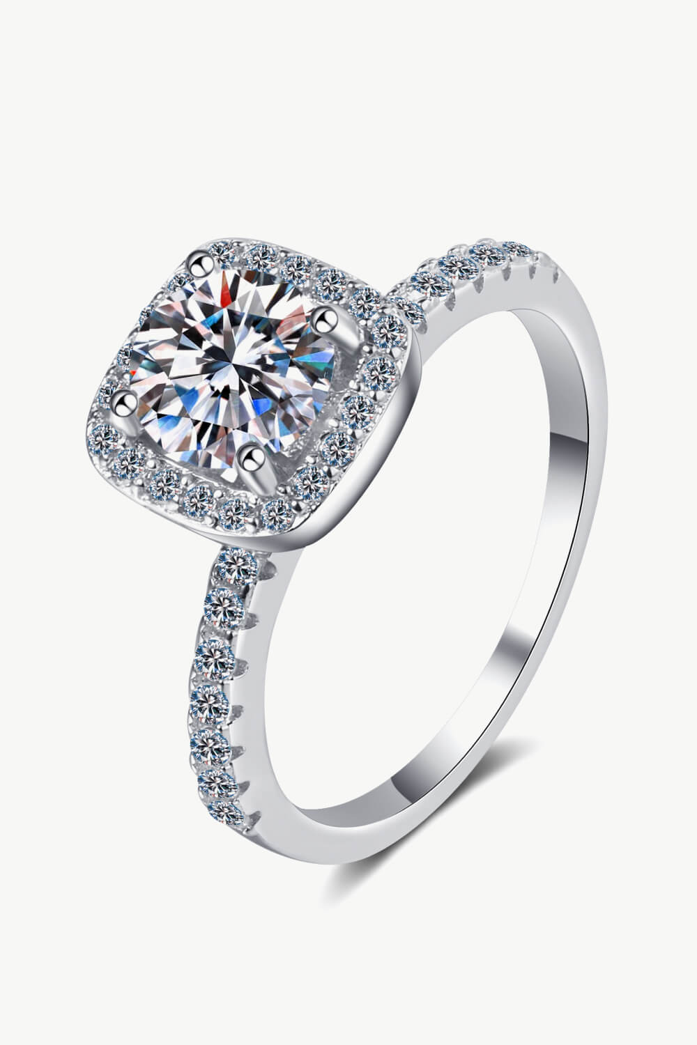 Silver square halo moissanite ring shown at an angle on a white background.