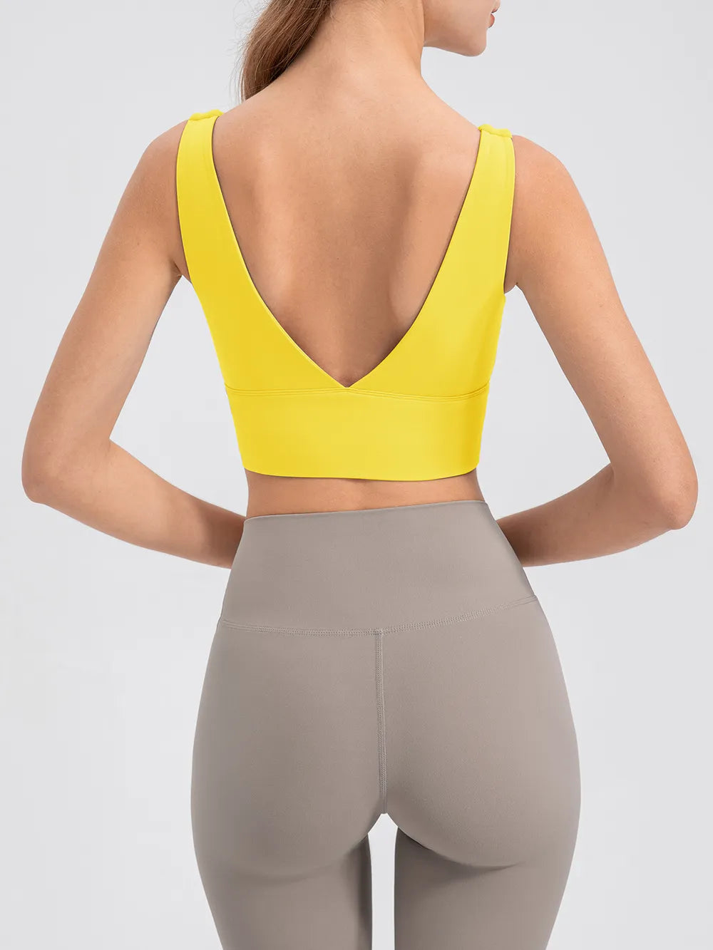 Back view of yellow tank with a deep V-shaped neckline