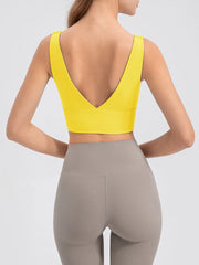 Back view of yellow tank with a deep V-shaped neckline