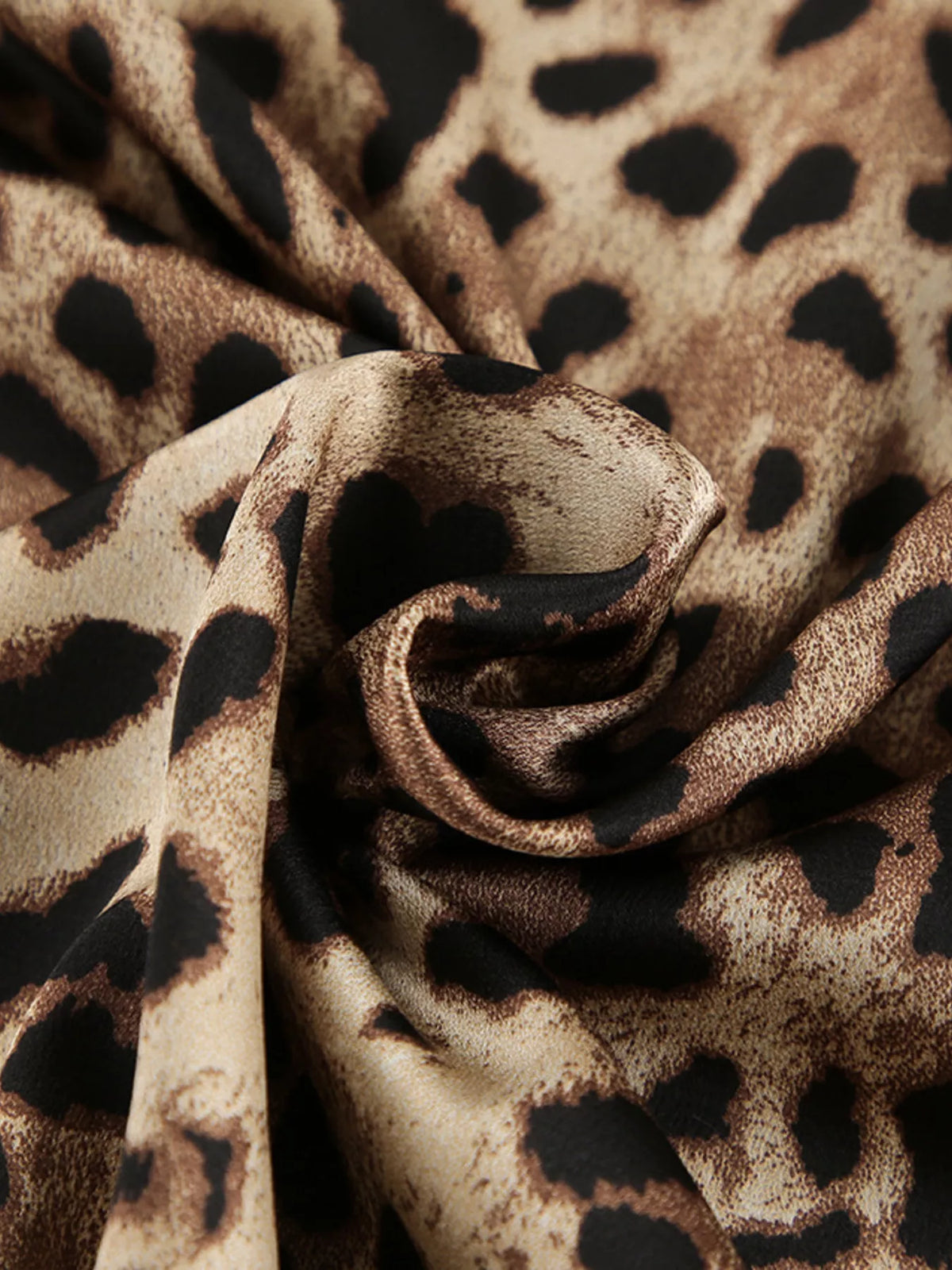 Macro view of leopard-print fabric folds