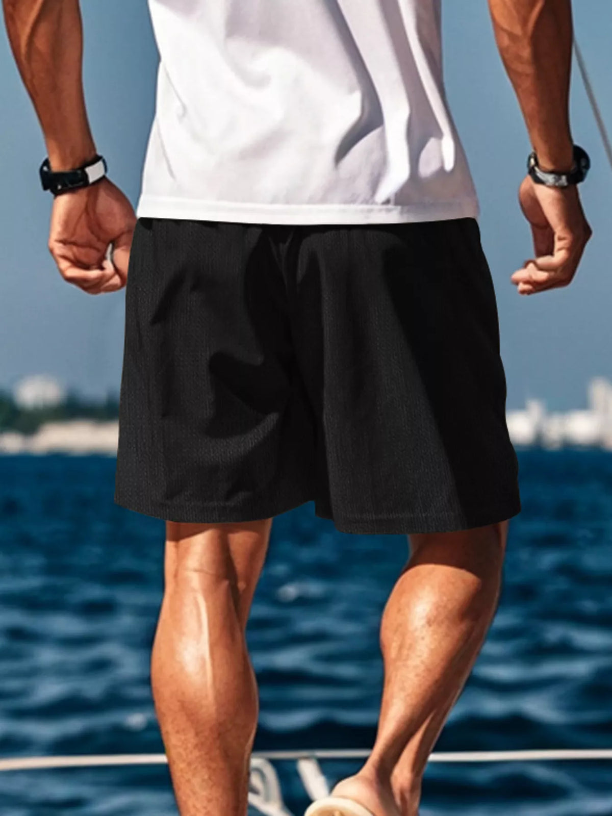 Rear view of black drawstring shorts
