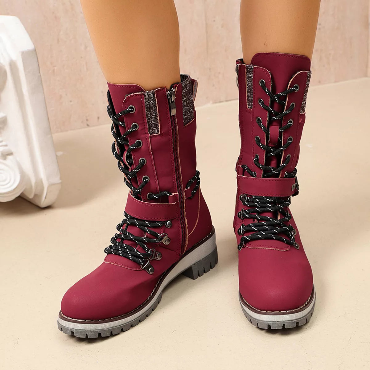 Burgundy boots shown from back with zipper detail