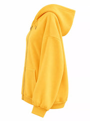 Side view of the yellow hoodie showing its hood profile and dropped shoulder