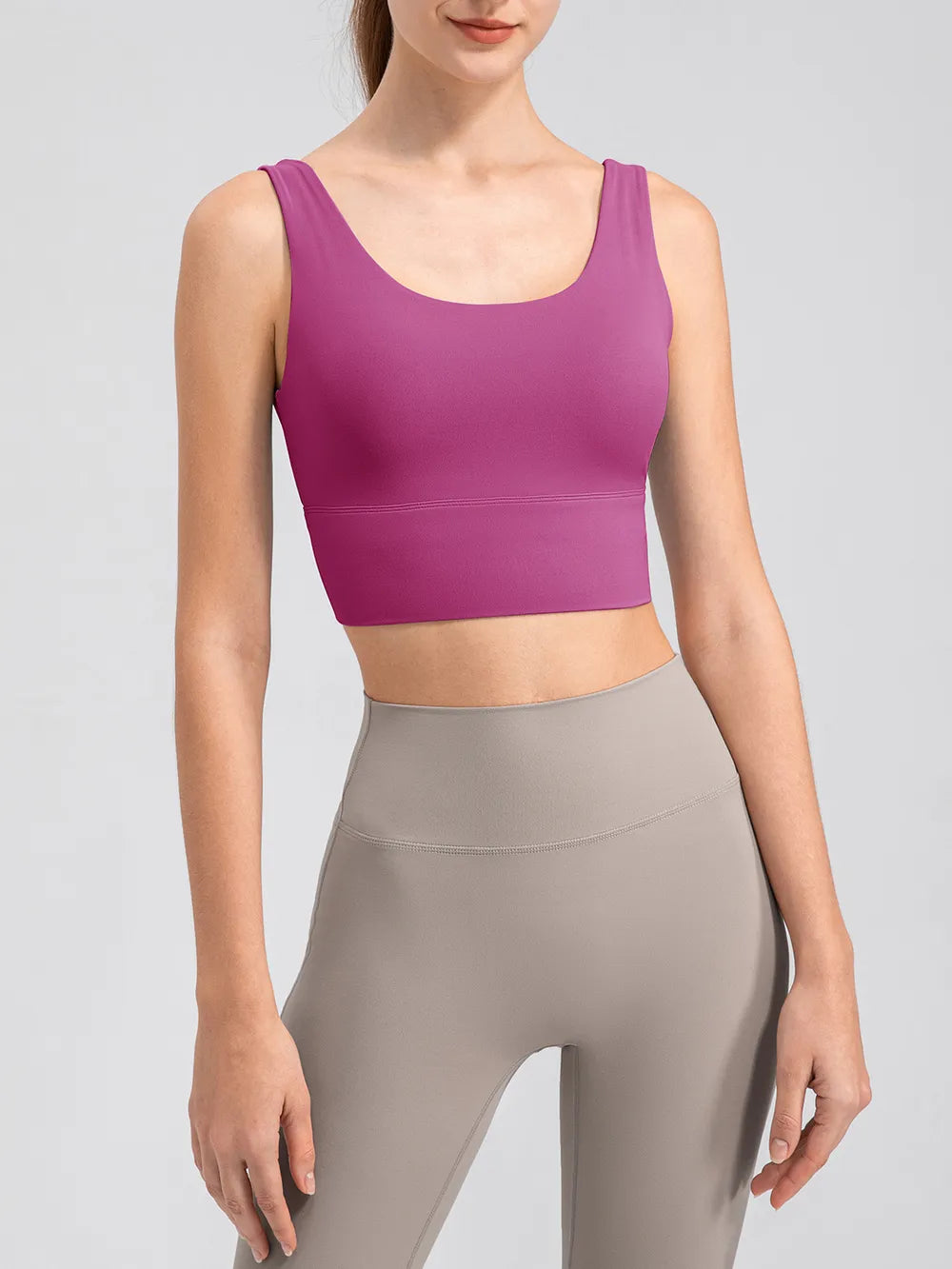 Magenta cropped tank showing the deep V-back and wide straps