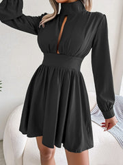 Back view of black cutout turtleneck A-line mini dress