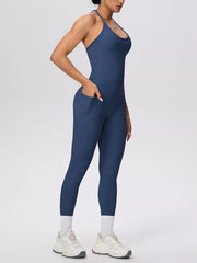 Back view showing fit of halter neck cami and high-waisted leggings active set