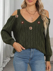 Dark olive floral-appliqué sweater worn with jeans, relaxed front pose