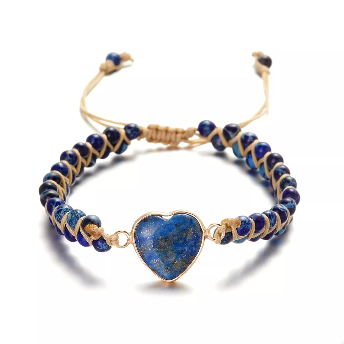 Blue heart bracelet with navy beads and gold-tone cords isolated on white.