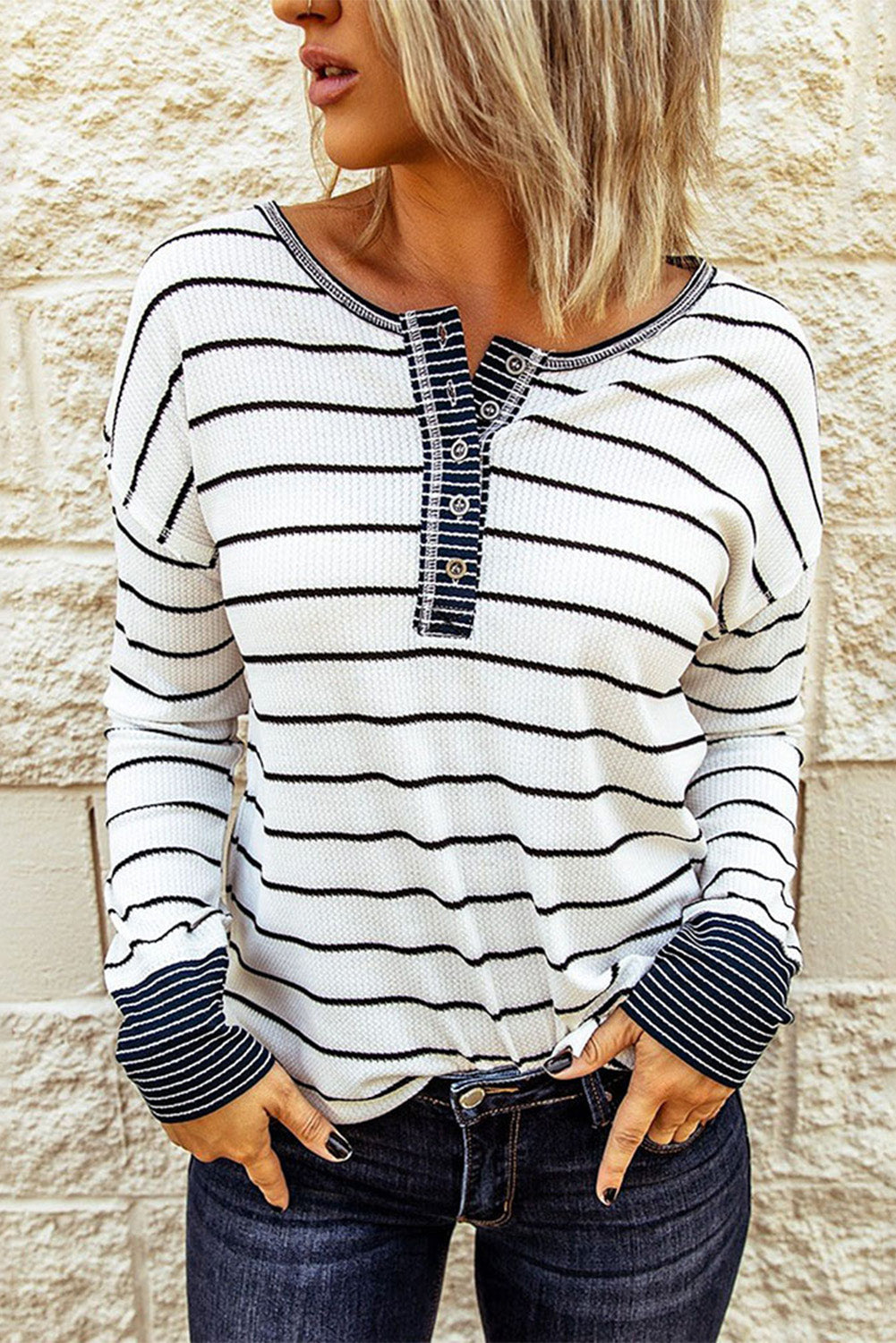 Front view showing dark Henley placket and striped body