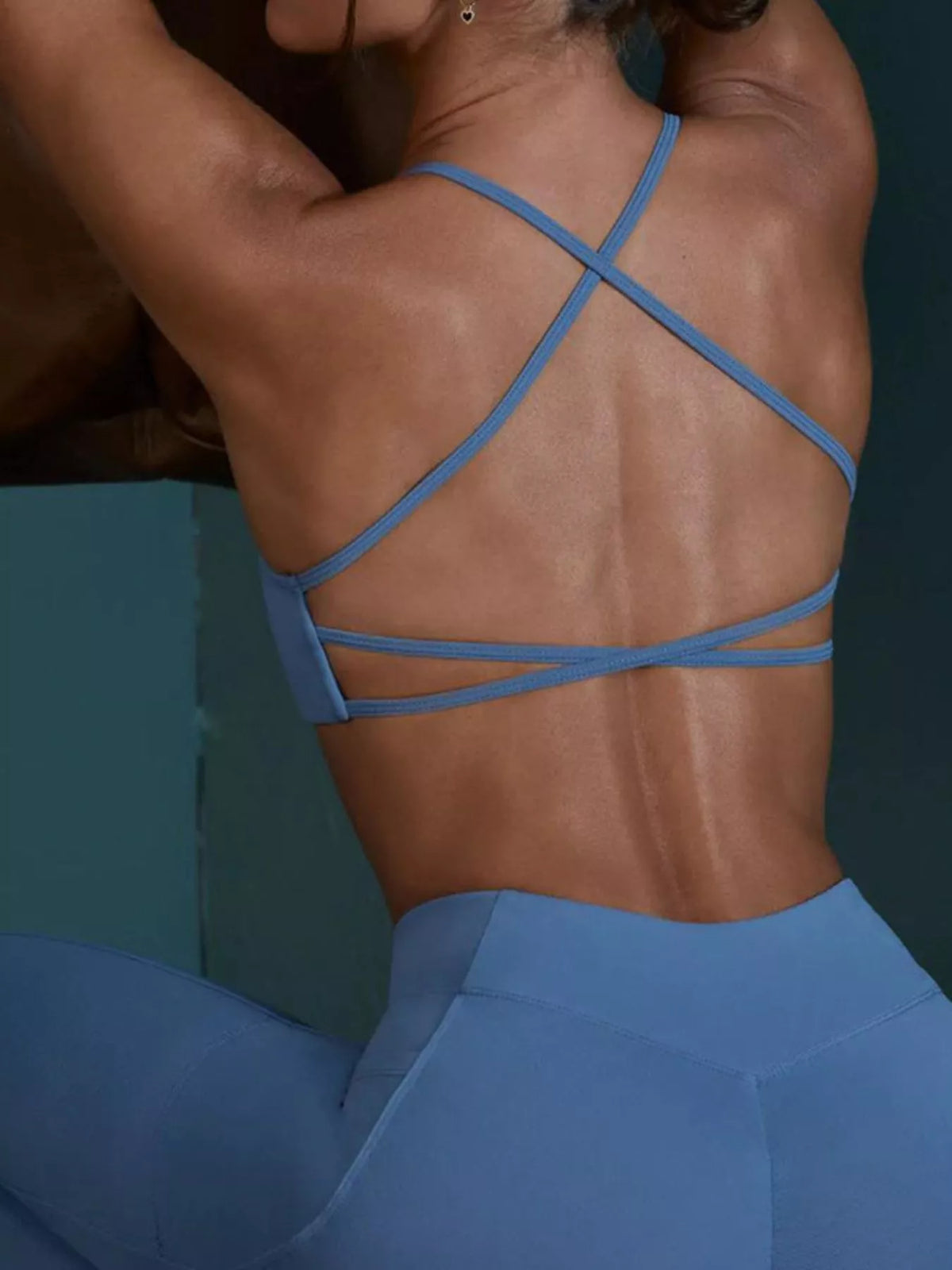 Back view showing fit of seamless cross-waist cami and leggings active set