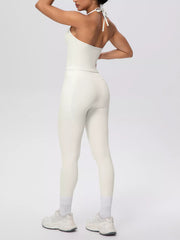 Close view of garment details of halter neck cami and high-waisted leggings active set