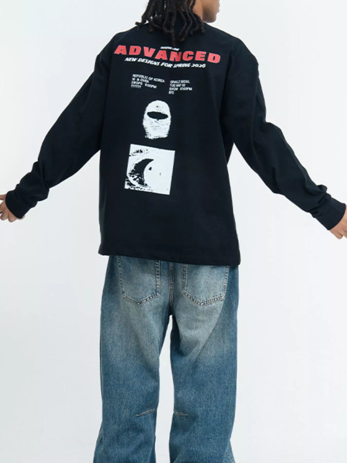 Black graphic long-sleeve shirt shown from the back with red lettering and stacked monochrome prints
