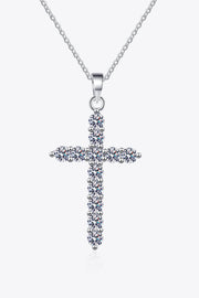 Front view of a clear-stone cross pendant necklace on white