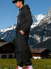 Side view of black hoodie and cuffed cargo joggers showing the thigh flap pocket