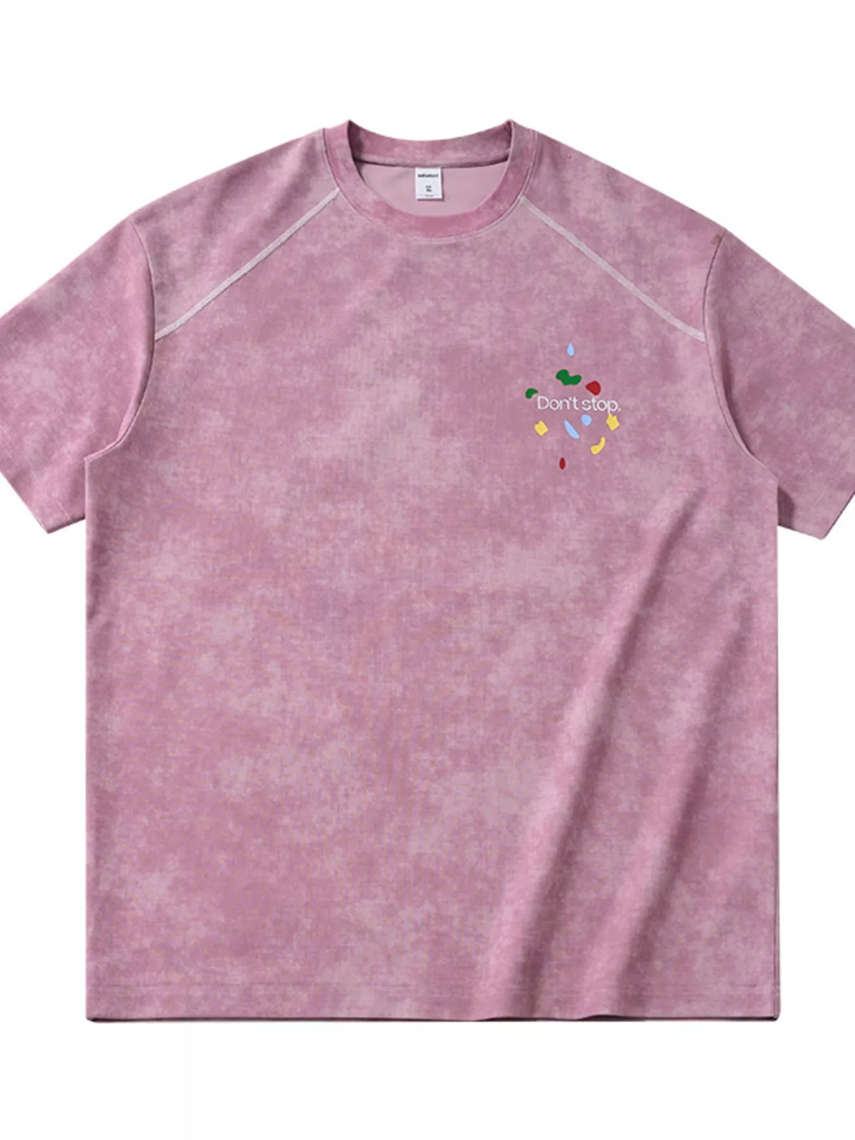 Front view of washed pink T-shirt with small chest graphic