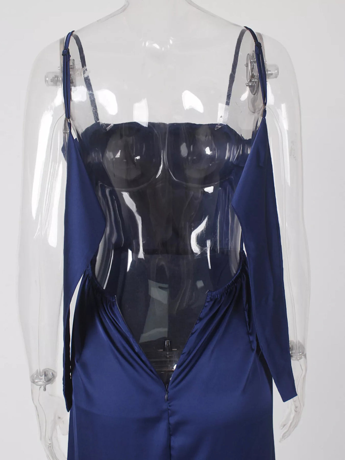 Back view of blue spaghetti-strap dress bodice on a clear form