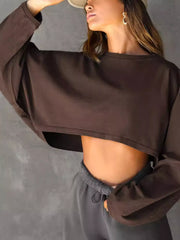 Angled view of dark brown cropped sweatshirt with oversized sleeves