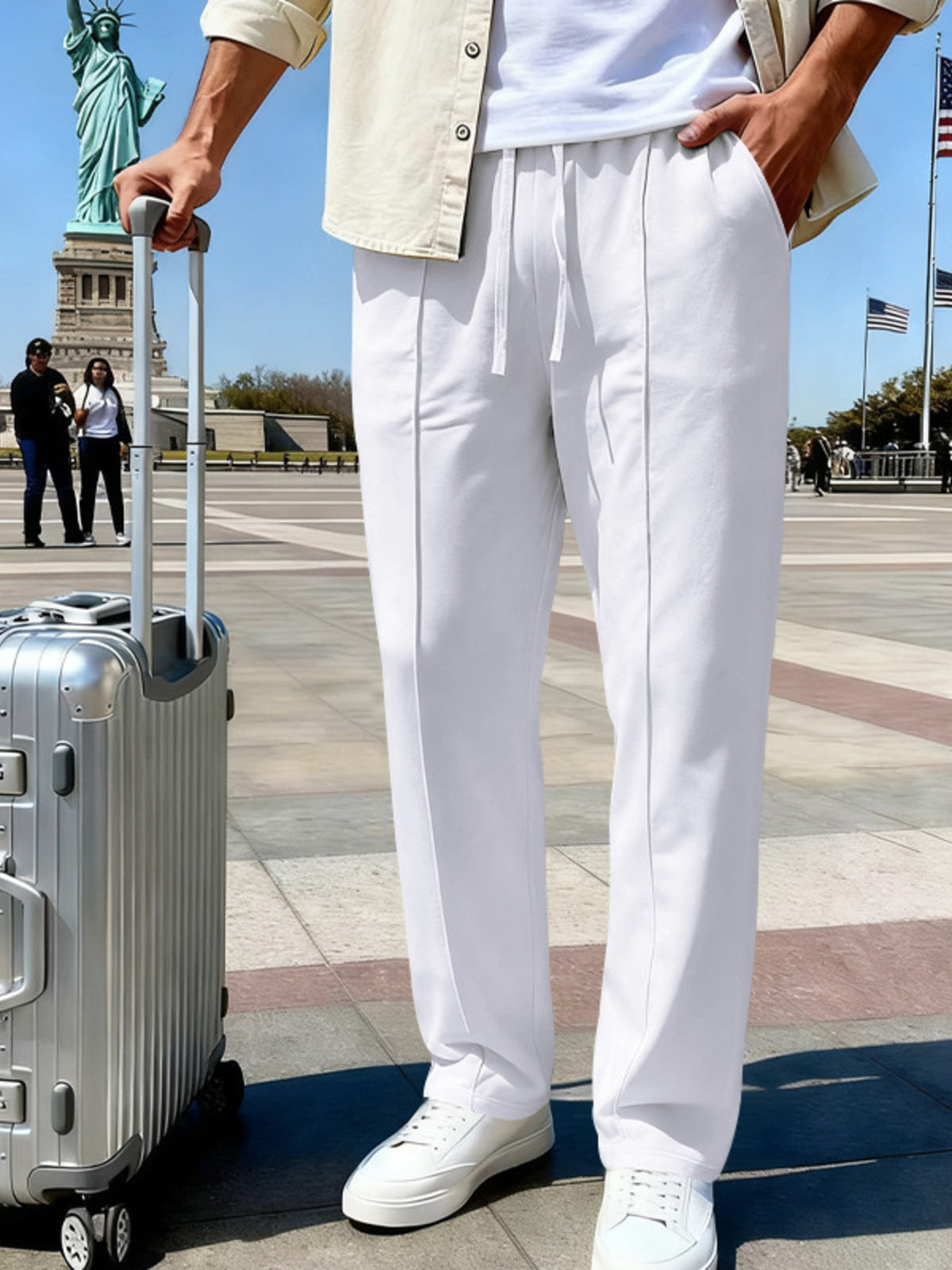 Front view of light blue drawstring pants near the Statue of Liberty.
