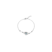 Full view of the silver bracelet and circular planet centerpiece