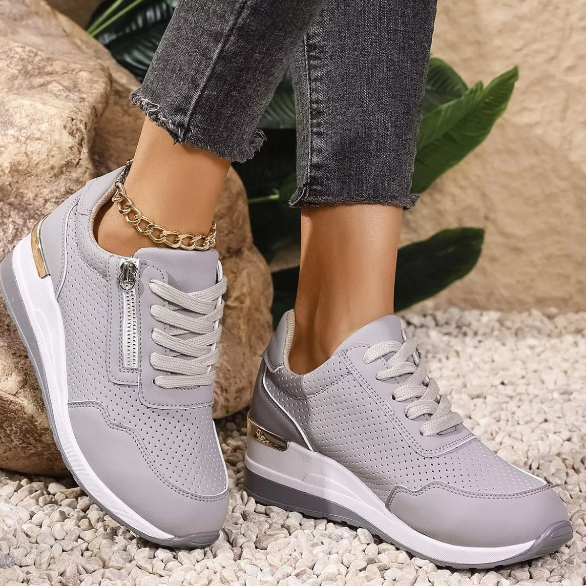 Gray knit lace-up sneakers with white wedge soles, side view