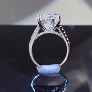 Side view showing the raised setting and band of the moissanite ring