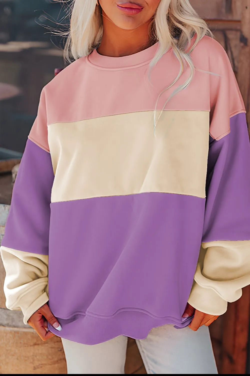Front view of pastel color-block sweatshirt on model