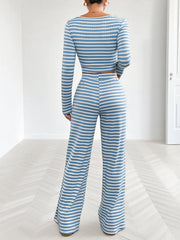 Back view of model in striped square-neck top and wide-leg pants
