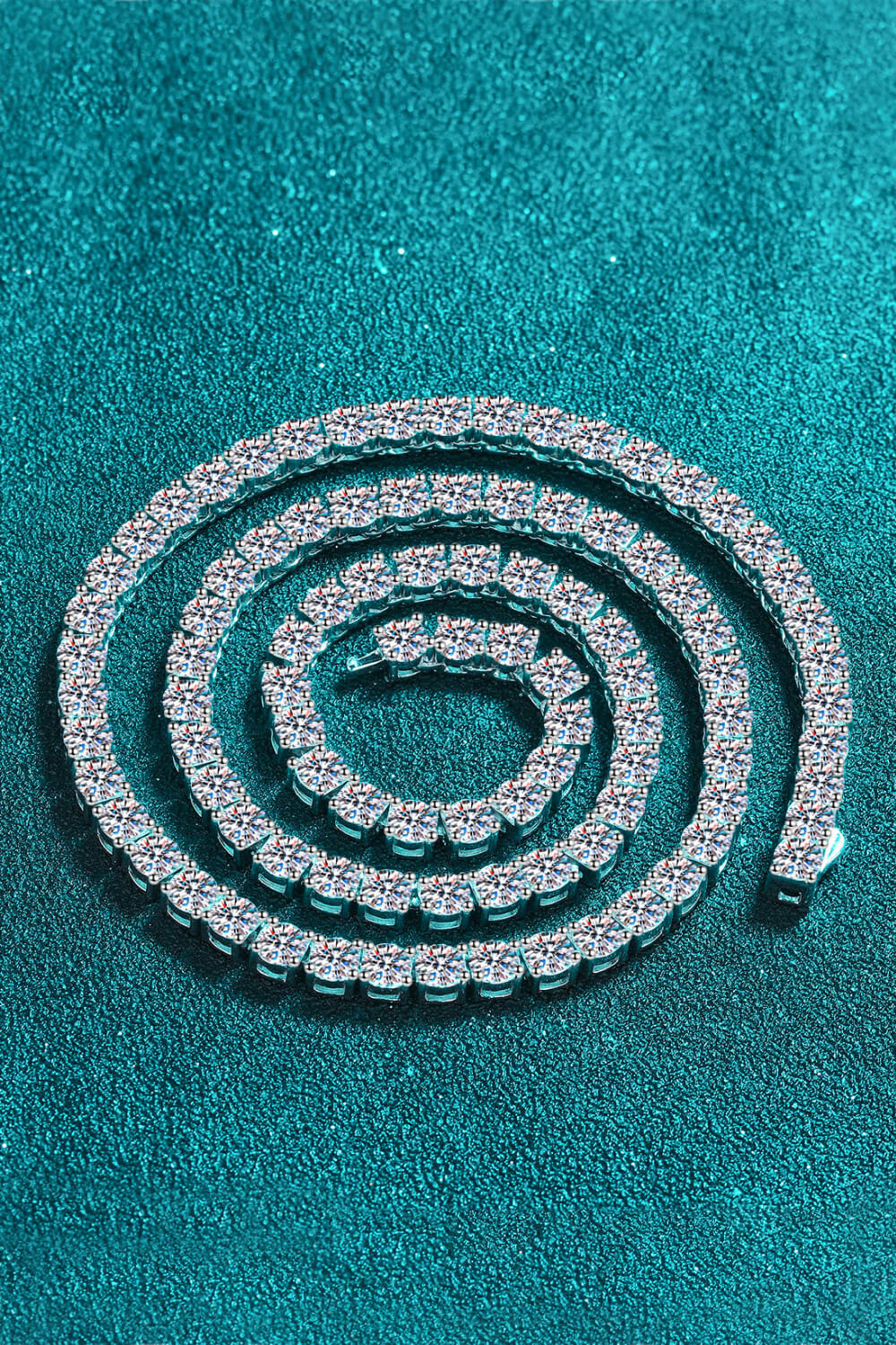 Rhodium-tone necklace with a line of bright stones arranged in a coil