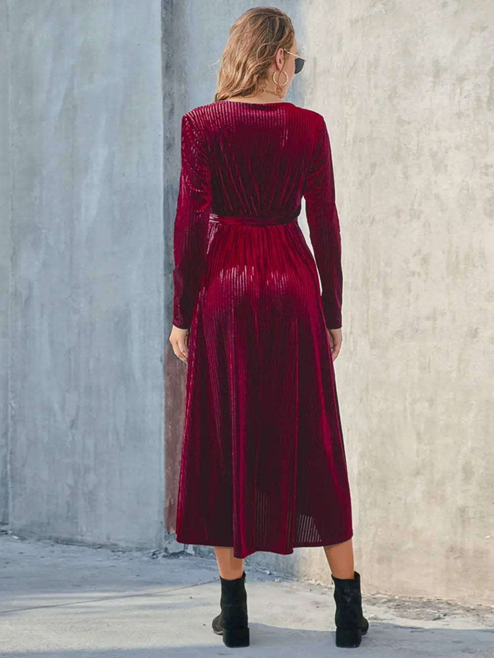 Back view of wine dress showing long sleeves and tied waist